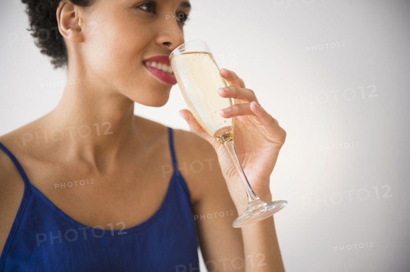 Black woman drinking champagne