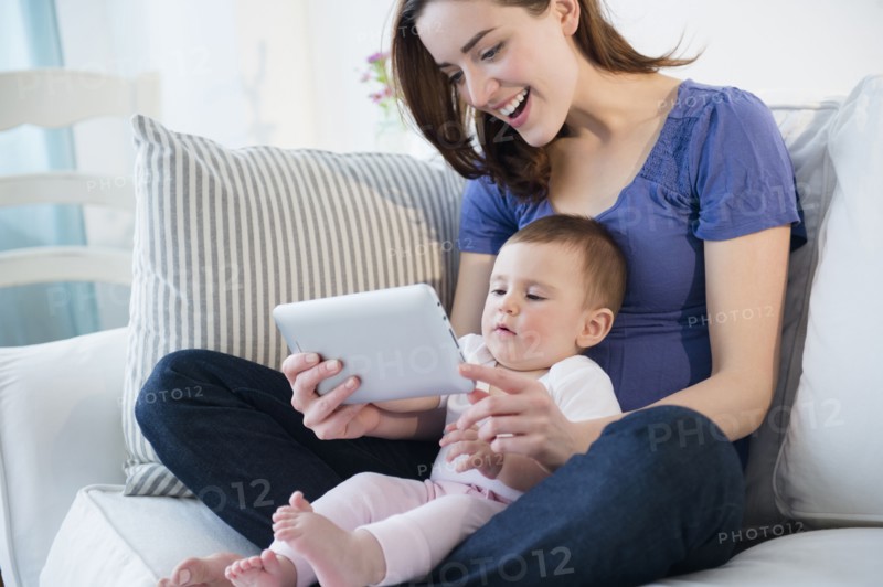 Mother and baby using digital tablet