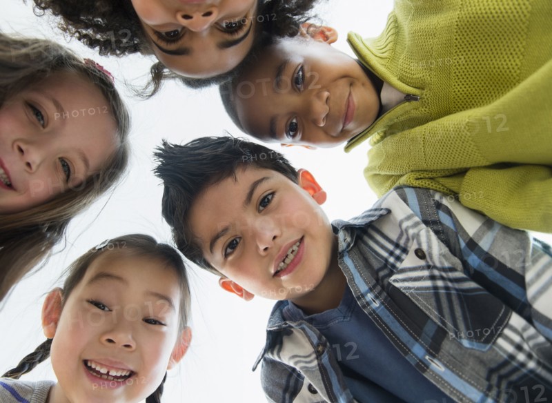 Children smiling in huddle