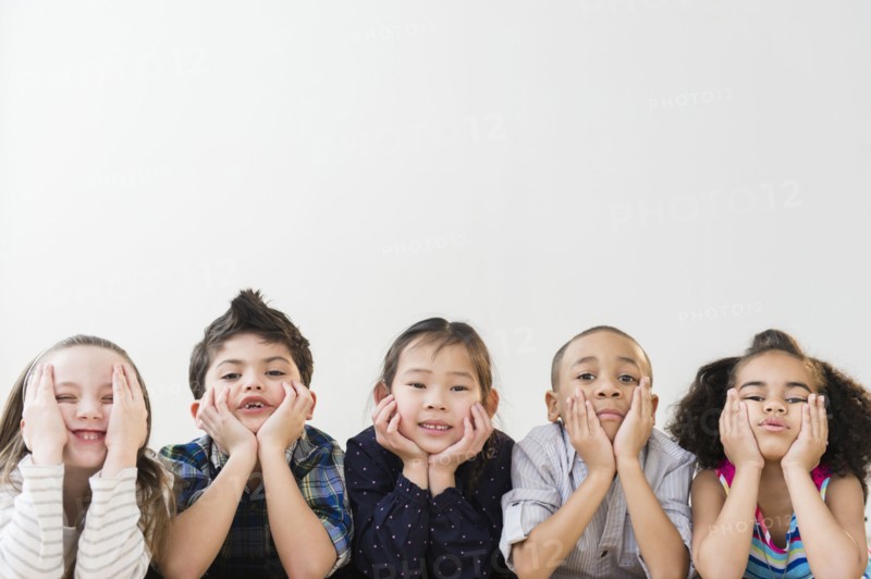 Children resting chins in hands