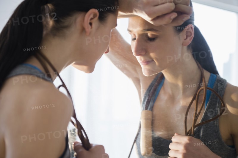 Caucasian woman resting after exercise