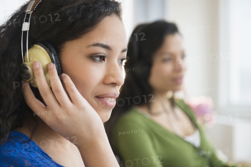 Teenage girl listening to headphones