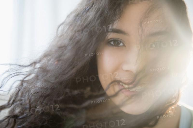 Mixed race teenage girl smiling