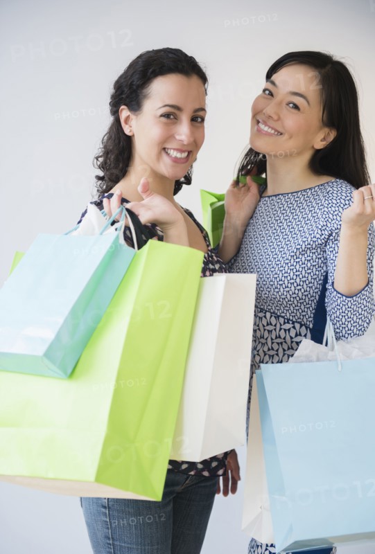 Smiling women shopping together