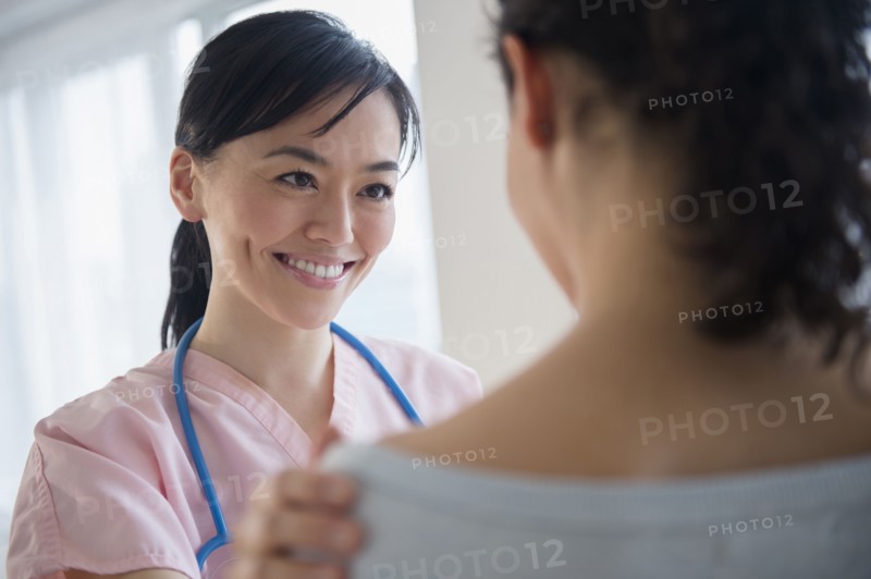 Nurse talking to patient in hospital