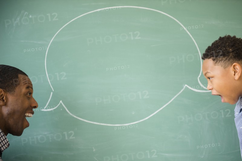 Teacher and student talking by empty speech bubble