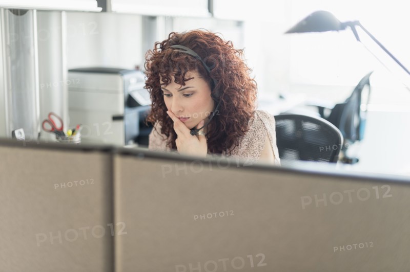 Hispanic businesswoman working in office