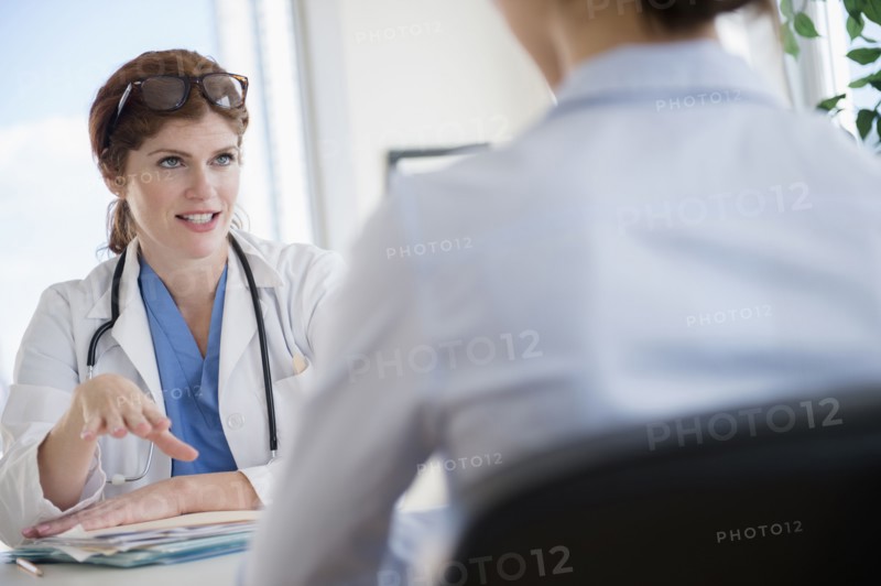 Doctor and patient talking in office