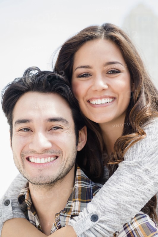 Smiling couple hugging