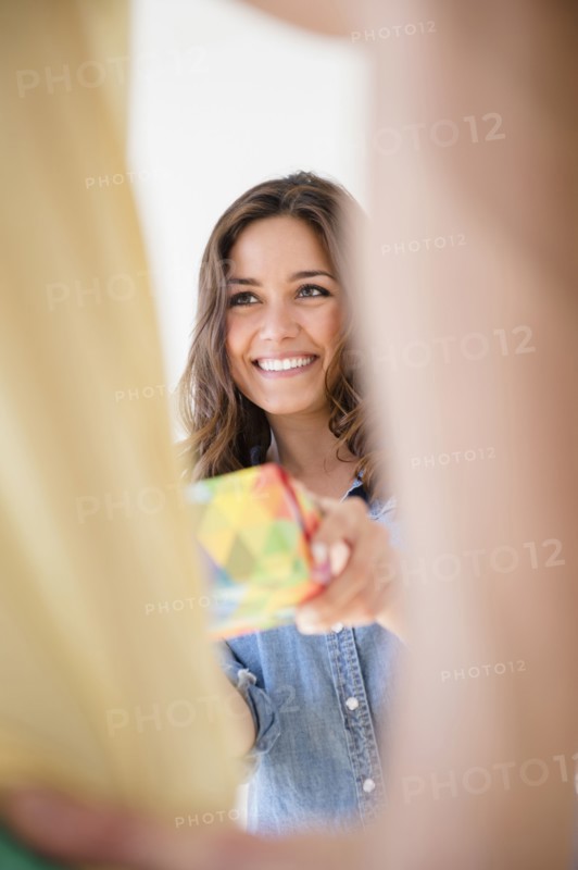 Woman giving boyfriend gift