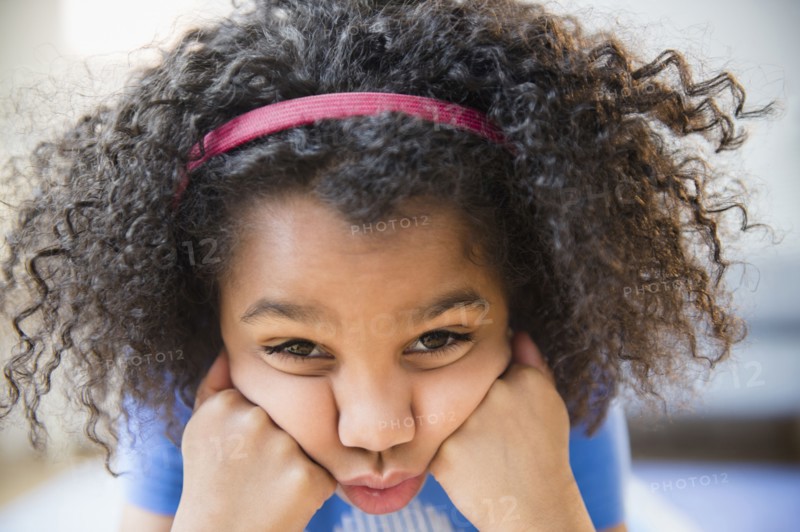 Close up of African American girl making a face