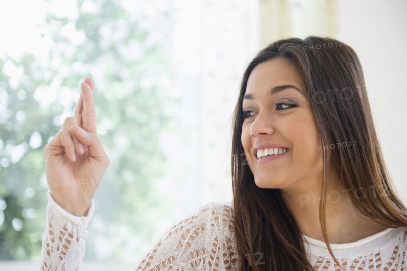 Woman crossing her fingers