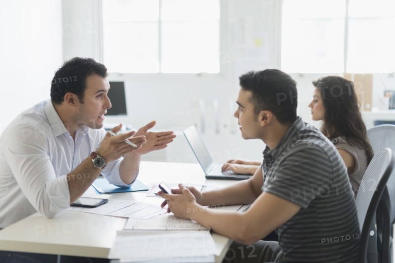 Hispanic business people working together in office