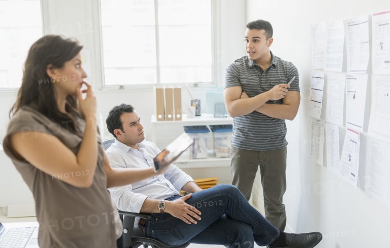 Hispanic business people working together in office
