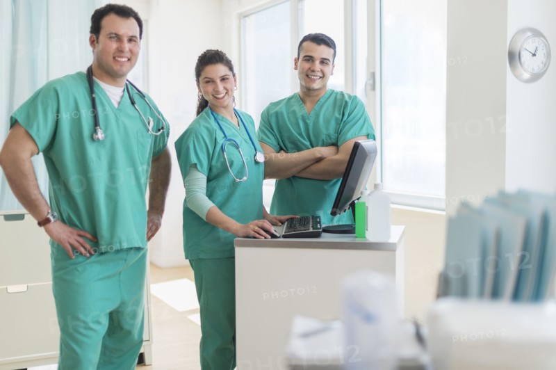 Hispanic nurses smiling in hospital