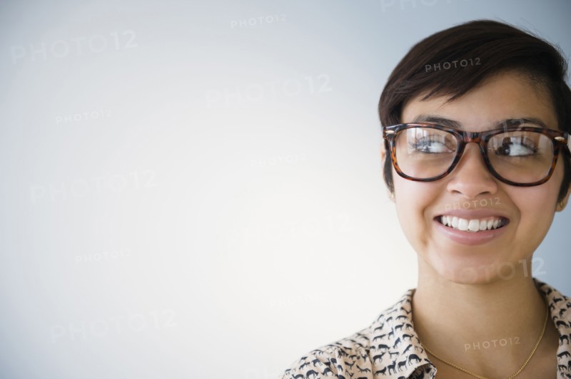 Smiling mixed race woman wearing eyeglasses