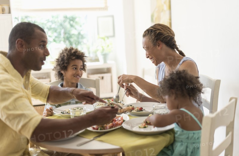 Family eating together at dining room table