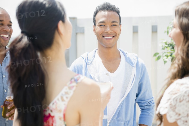 Friends talking at party
