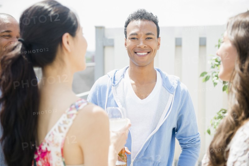 Friends talking at party
