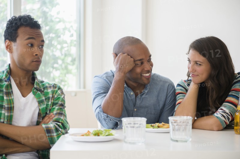 Man surprised at friends flirting