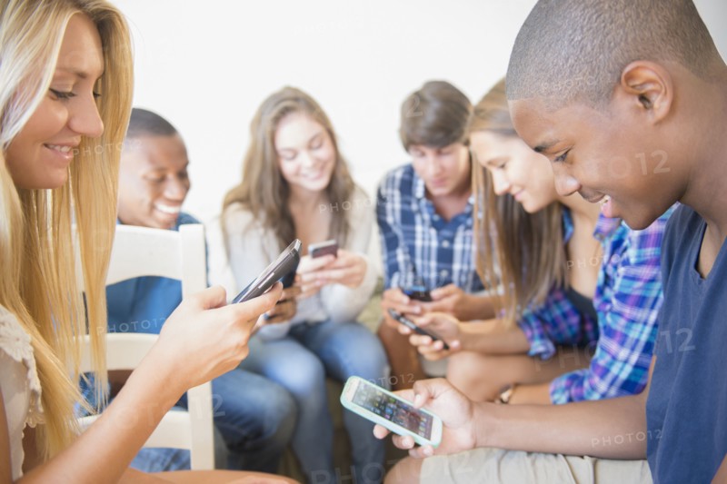 Teenagers using cell phones