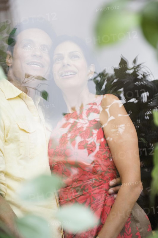 Couple hugging and looking out window
