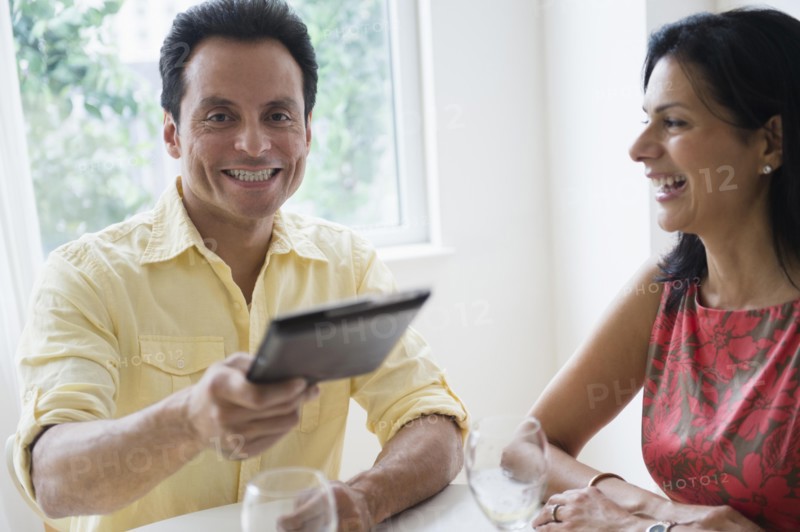 Couple paying check in restaurant