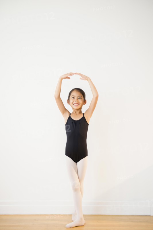 Vietnamese girl posing during ballet lesson