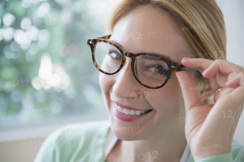 Smiling Caucasian woman wearing eyeglasses