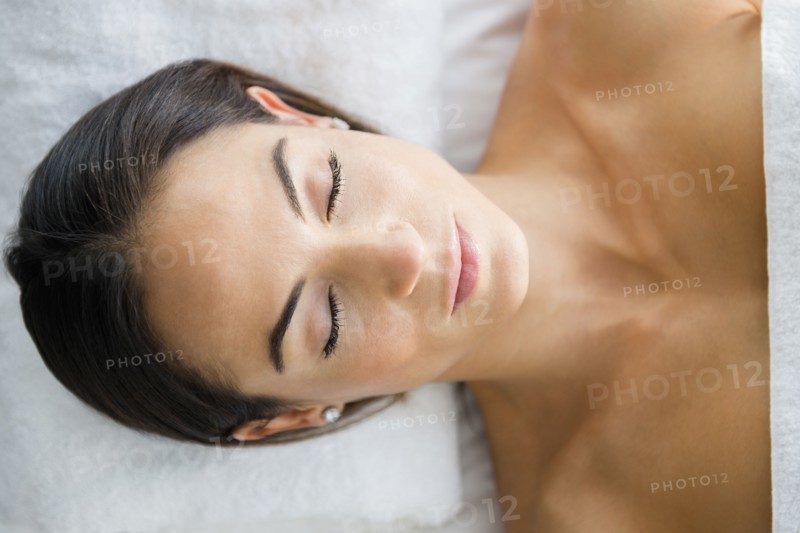 Caucasian woman laying on massage table