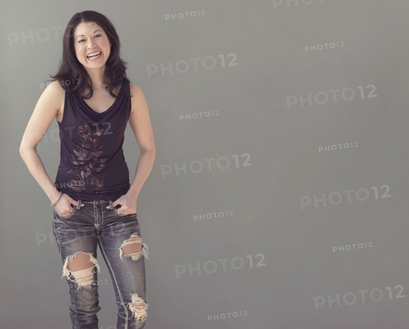 Mixed race woman wearing ripped jeans