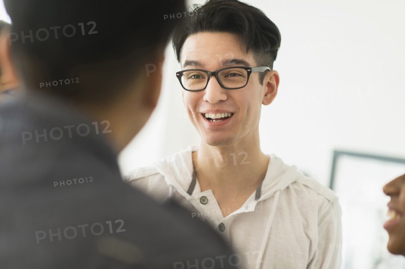 Smiling friends talking