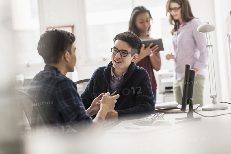 Businessmen working together in office