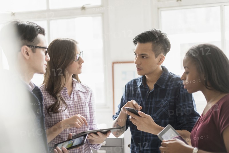 Business people working together in office with technology
