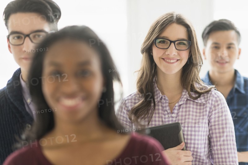 Smiling businesswoman holding digital tablet in office