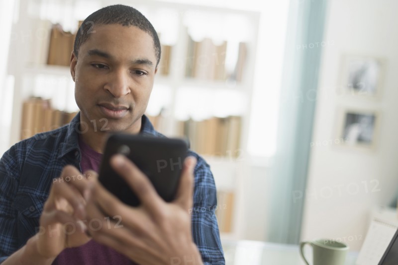 Black man using digital tablet