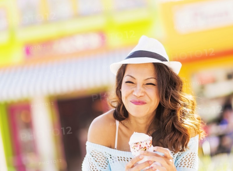 Chinese woman eating ice cream cone