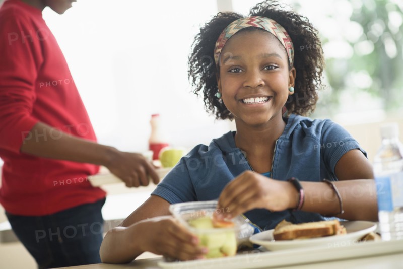 Black students eating lunch in school cafeteria