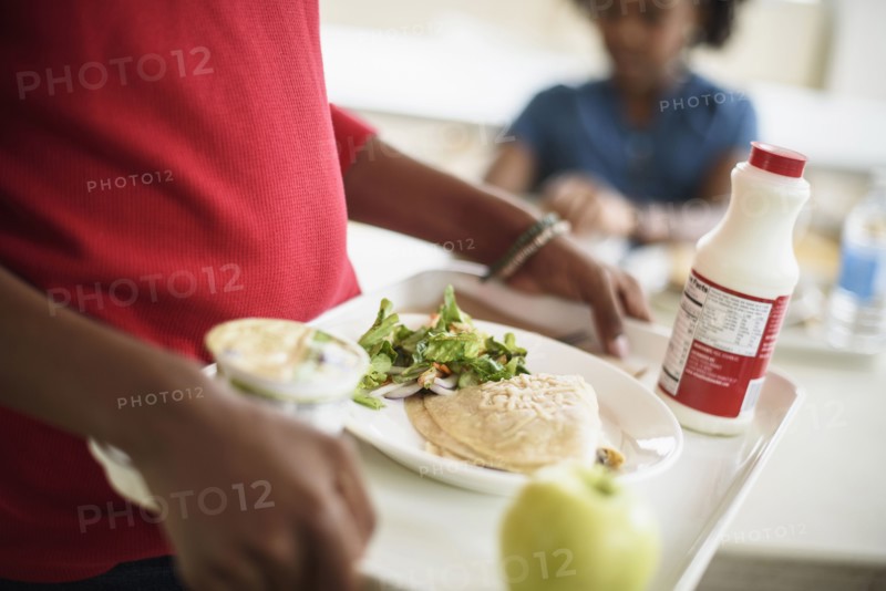 Black students eating lunch in school cafeteria