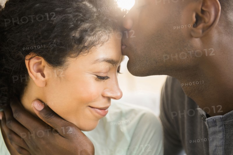 Close up of smiling couple kissing