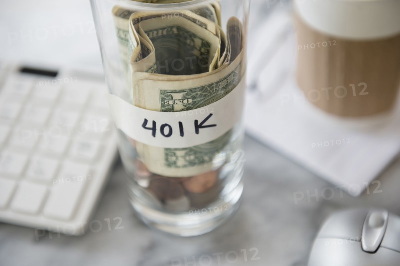 Close up of savings cup on office desk