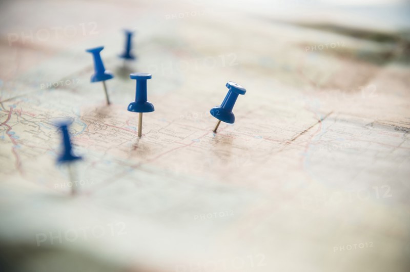 Close up of pushpins on roadmap route