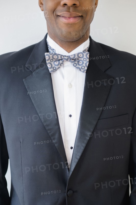 Close up of smiling groom wearing tuxedo