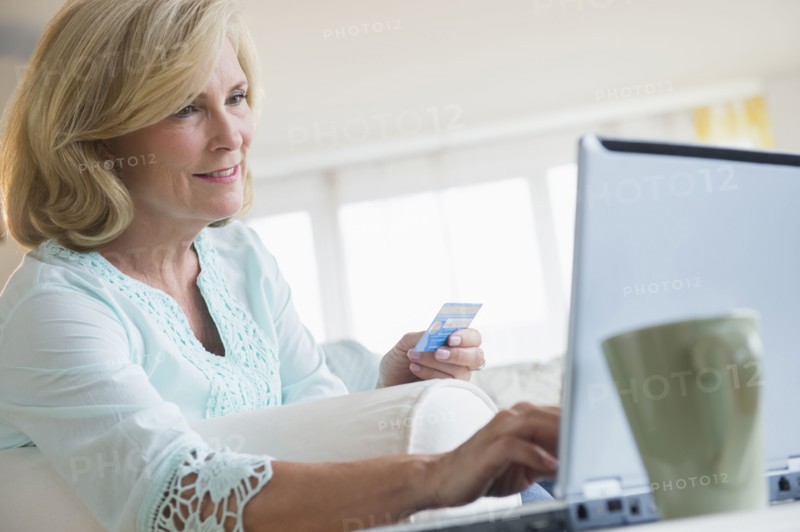 Caucasian woman shopping online with laptop
