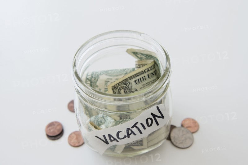 Close up of vacation savings jar