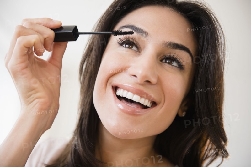Close up of woman applying makeup