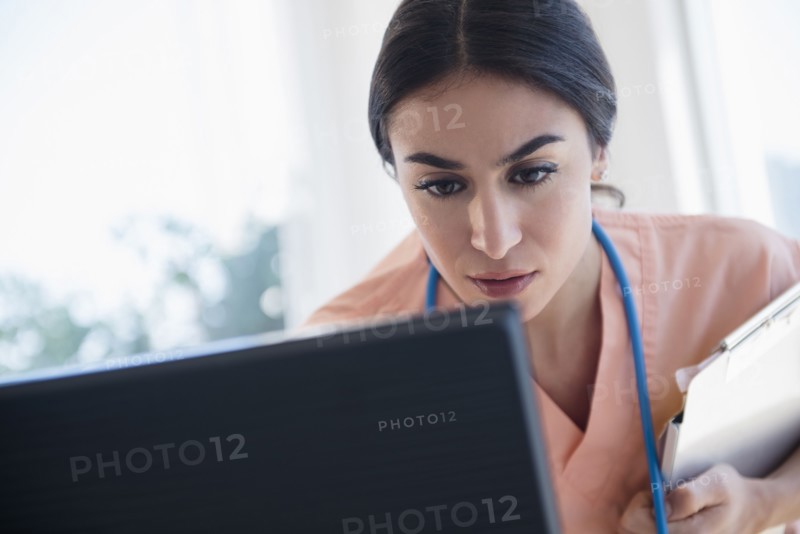 Nurse using computer in hospital