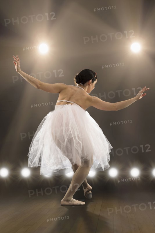 Hispanic ballet dancer performing on stage