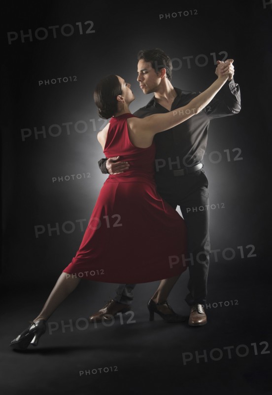 Hispanic salsa dancers performing