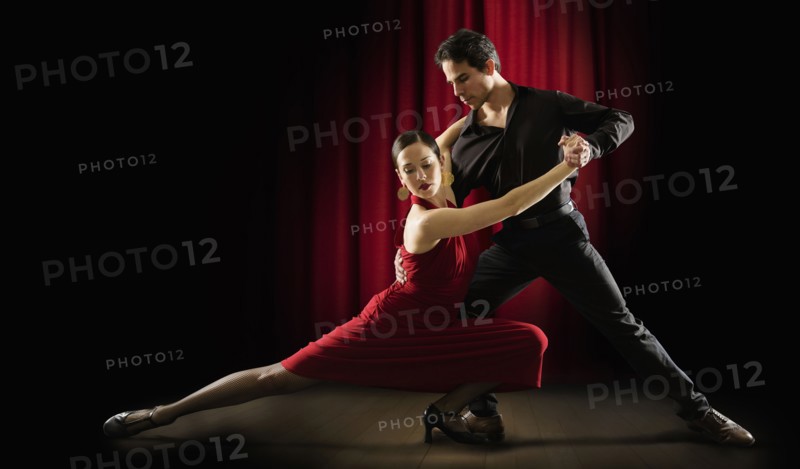 Hispanic salsa dancers performing